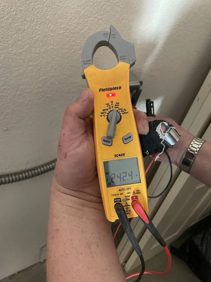 Voltage testing with clamp meter during Outlet Installation in Broadview Park